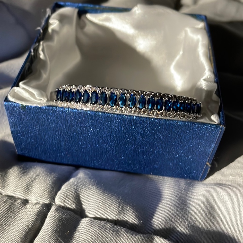 Simulated sapphire diamond bracelet with clasp opening